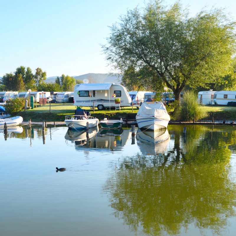 Camping,Site,On,A,Lake,With,Caravans,And,Boats